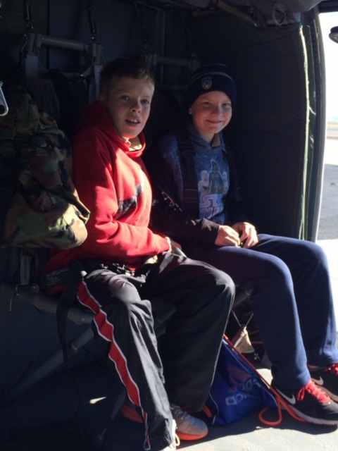 Scouts enjoy sitting in a helicopter at the Youth Aviation Adventure